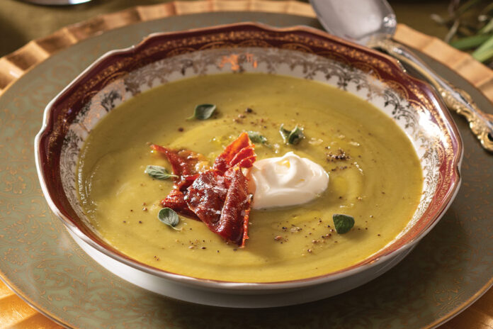 A cozy addition to the menu is Herbed Pea Soup, a tasty vegetable blend seasoned with oregano, drizzled with olive oil, and topped with a dollop of crème fraîche and ruffles of crisped prosciutto.