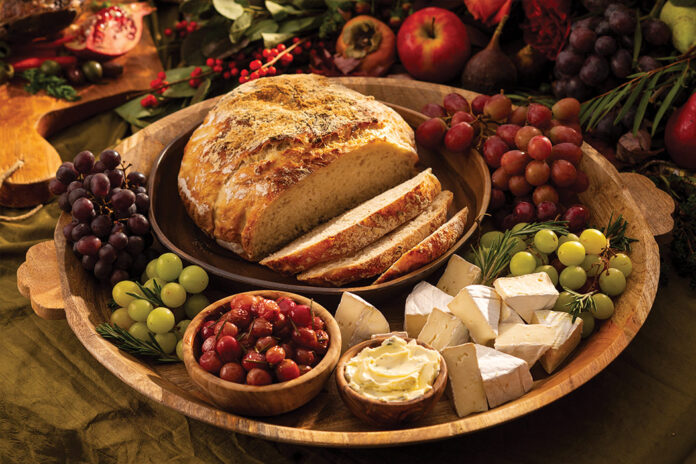 The aroma of fresh-baked Peasant Bread welcomes guests—a recipe reminiscent of the wood-fired loaves warmed in stone hearths centuries ago.