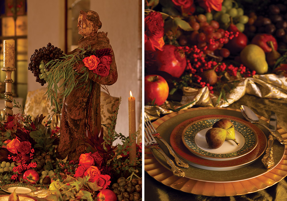 A bountiful garland of fruit and flowers dresses the table, which is set with fine china and crystal.