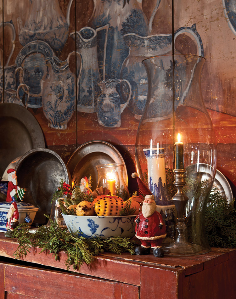 A time-worn mantlepiece in Williamsburg, decorated in vintage festive fare.
