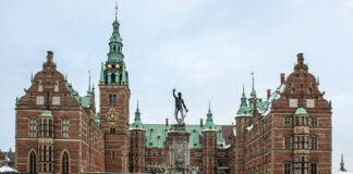 Four of Denmark's Finest Castles: A frosted fountain sits before the façade of Frederiksborg Castle in Denmark