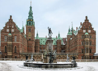 Four of Denmark's Finest Castles: A frosted fountain sits before the façade of Frederiksborg Castle in Denmark