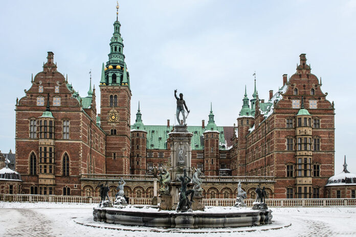 Four of Denmark's Finest Castles: A frosted fountain sits before the façade of Frederiksborg Castle in Denmark