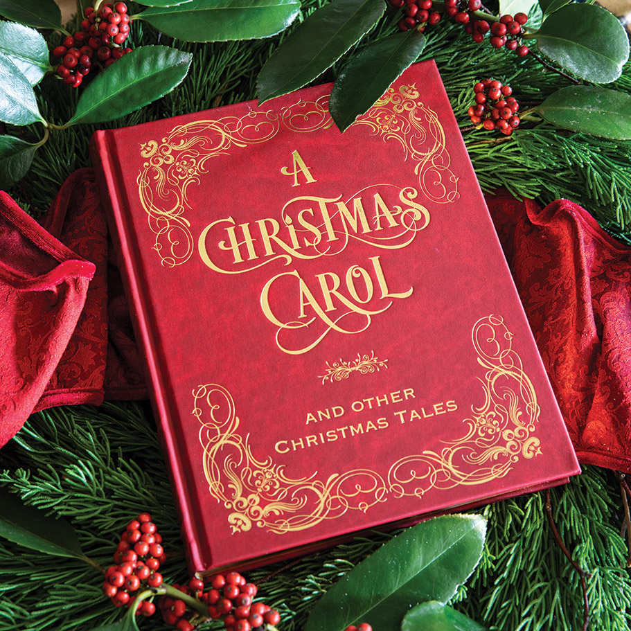 The rich red cover of our latest book club selection, A Christmas Carol, invites readers to revisit this classic tale of Yuletide spirit.