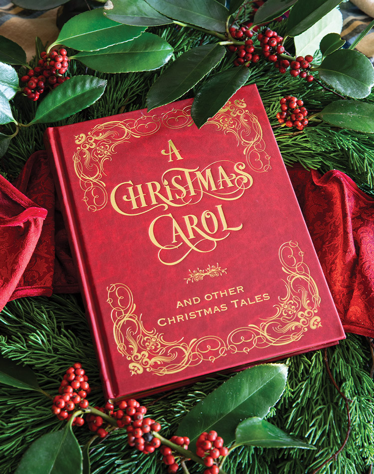 The rich red cover of our latest book club selection, A Christmas Carol, invites readers to revisit this classic tale of Yuletide spirit.