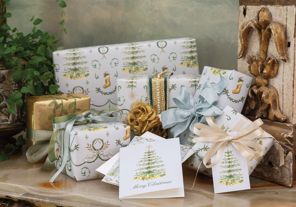 Gifts wrapped in the Victoria X Dogwood Hill Blissful Holiday Collection mingle with written cards and gift tags from the same line, all designed by the Senior Director of Design of the magazine you love.