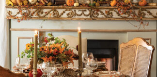 Beside the roaring fireplace, its mantel bedecked in vines and pumpkins, a small round table is set for the loveliest Thanksgiving meal.