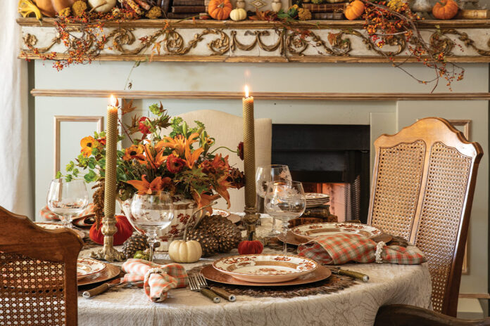 Beside the roaring fireplace, its mantel bedecked in vines and pumpkins, a small round table is set for the loveliest Thanksgiving meal.