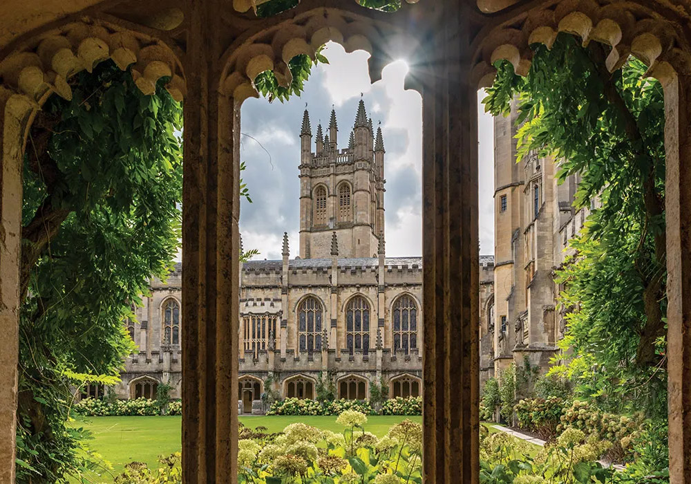 The halls of Magdalen College are filled with history and are as beautiful as they are old. Here, the sun shines beyond the main tower and into the courtyard.