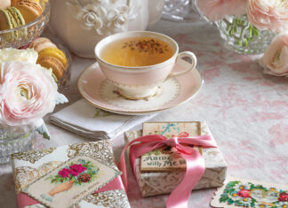A pink blush covers this tea table, dressed with feminine china, pale roses, and Valentine cards.