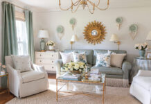 The formal living room designed by Tuft & Trim is a green-and-white haven brimming with vintage style and gold finishes.