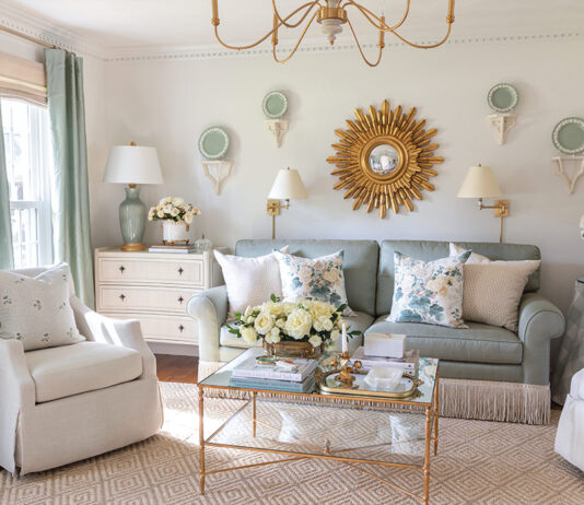 The formal living room designed by Tuft & Trim is a green-and-white haven brimming with vintage style and gold finishes.