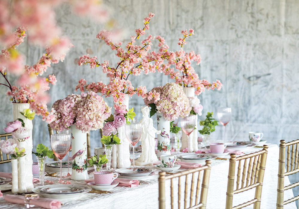 Japanese style alights on this tabletop, dressed in blushing hydrangea and cherry blossoms.