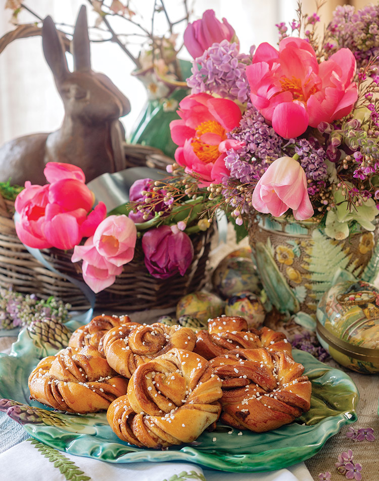 Rabbit motifs and vibrant tulips bring classic tidings to this Scandinavian-inspired Easter table.