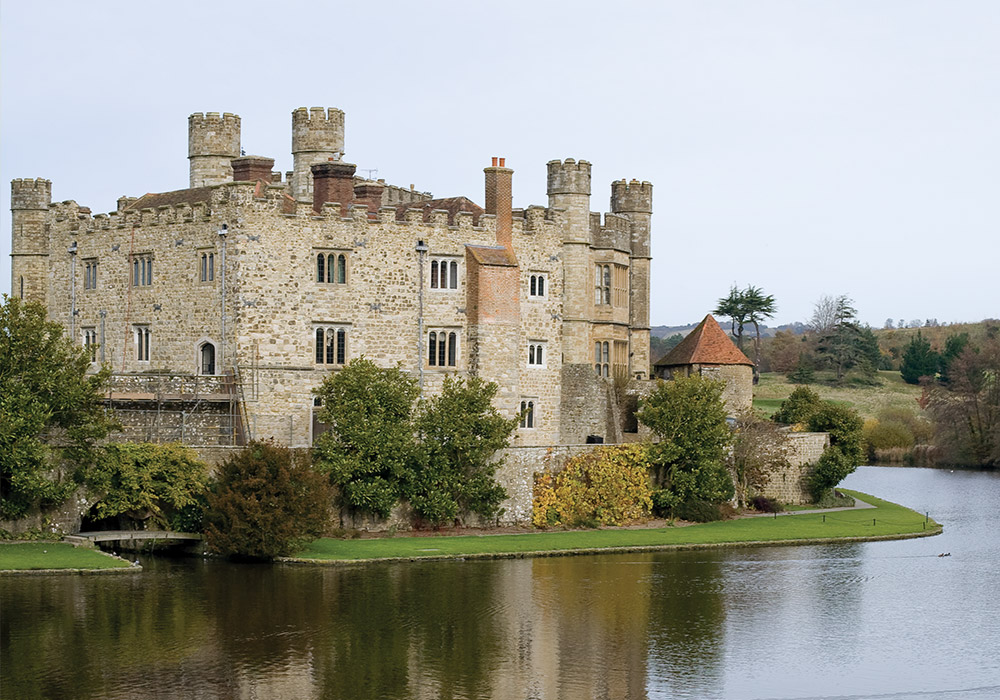 The ancient walls of Leeds Castle reflect upon the sparkling waters of the River Len.