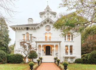 The white Victorian Italianate façade of Mayhurst Estate is an architectural wonder in the Virginia countryside.