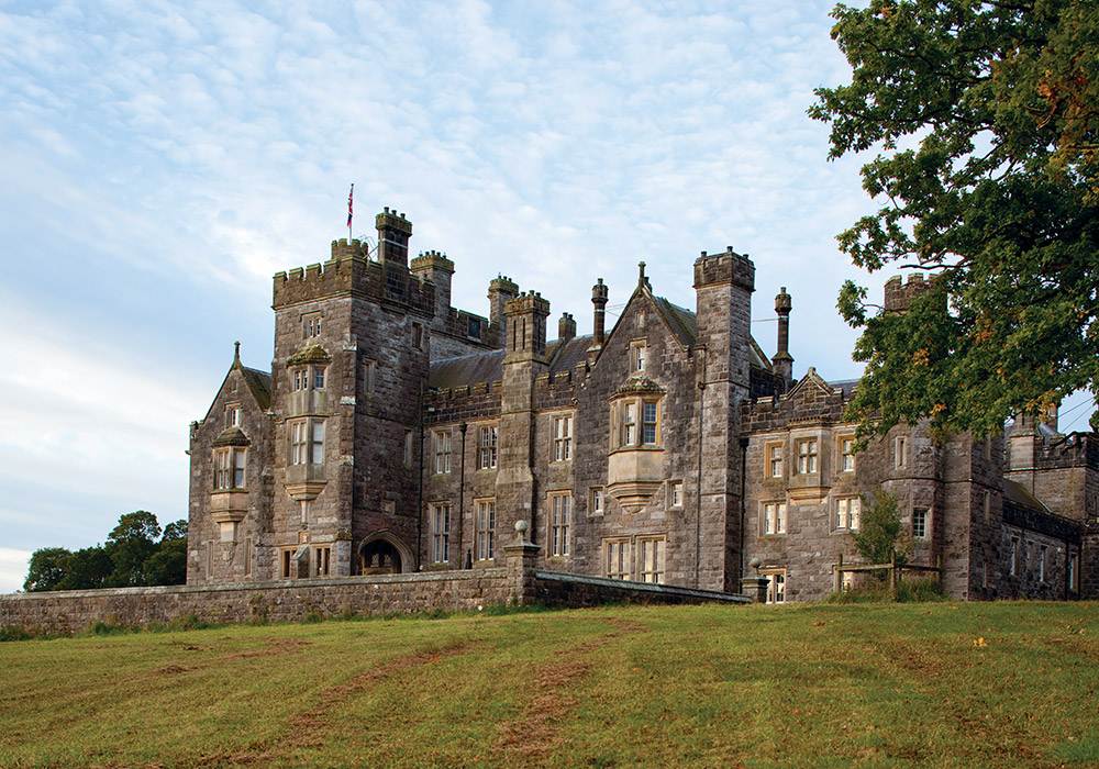 A patchwork of verdant fields surrounds the venerable stone façade of Crom Castle.
