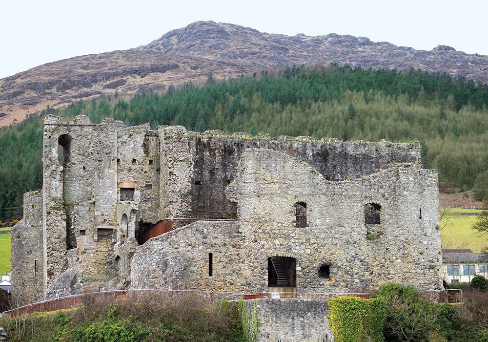 Raised above the shores of Carlingford Lough, the rocky, curved façade of King John’s Castle is visible across the medieval town.