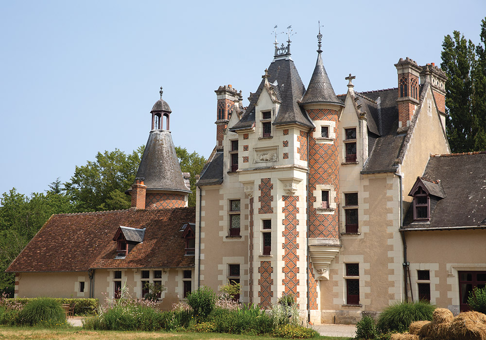 The exterior of Château de Troussay, the smallest castle of the Loire Valley, boasts brick charm.