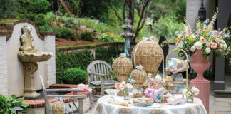 Here we offer an array of May Day ideas to revive pastoral fêtes. Set alongside a bubbling fountain in the ivy-laced cloister of a garden, a softly hued table is laden with spring blooms tucked into the basket of rattan hot air balloons, festive packages, and seasonal table settings.