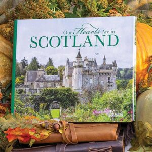 Victoria's hardcover volume Our Hearts Are in Scotland sits displayed amid autumnal decor.