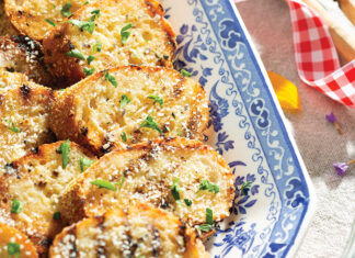 Grilled Garlic Bread is the perfect complement to a lakeside gathering. Each crunchy and buttery slice is a delicious vehicle for several summertime dishes. The smoky kiss from the char is a reminiscent and nostalgic flavor of summer.