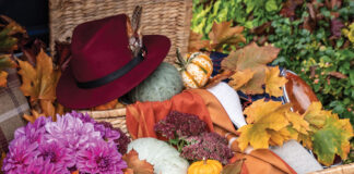 Natural trunks spill with pumpkins, mums, and fall leaves in this collection of autumn’s bounty nestled in the trunk of a classic car.