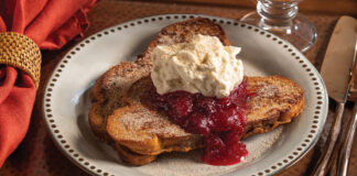 A serving of cinnamon French toast with cranberry compote and crème fraiche whipped cream bring autumnal charm to the breakfast table.