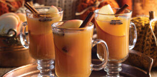Unique glasses with quaint handles offer the perfect home for servings of mulled cider, with sticks of cinnamon, slices of apple, and star anise floating at the top.