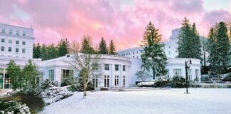 The Greenbrier, nestled in the heart of the Allegheny Mountains, covered with snow.