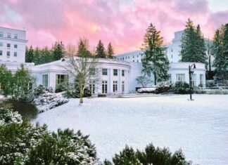 The Greenbrier, nestled in the heart of the Allegheny Mountains, covered with snow.