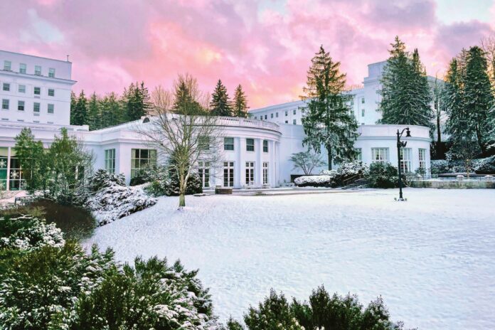 The Greenbrier, nestled in the heart of the Allegheny Mountains, covered with snow.