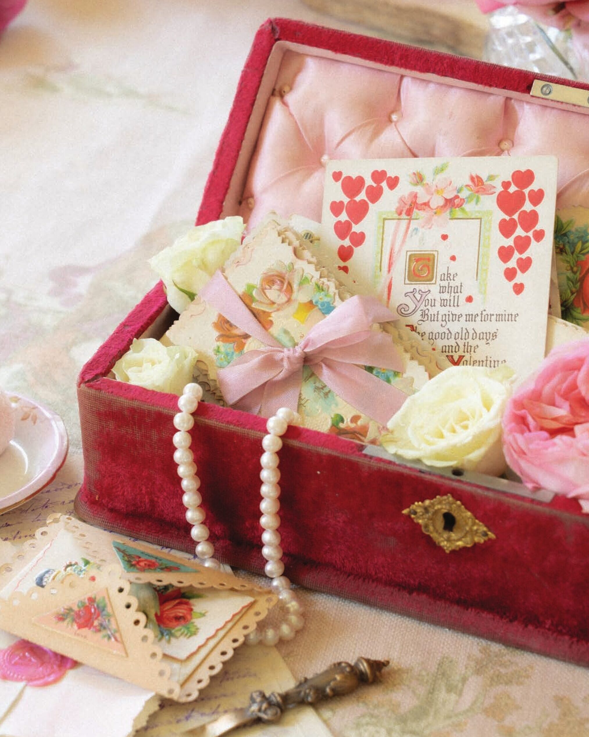 A nineteenth-century French red velvet glove box now stores small letters for reminiscing.