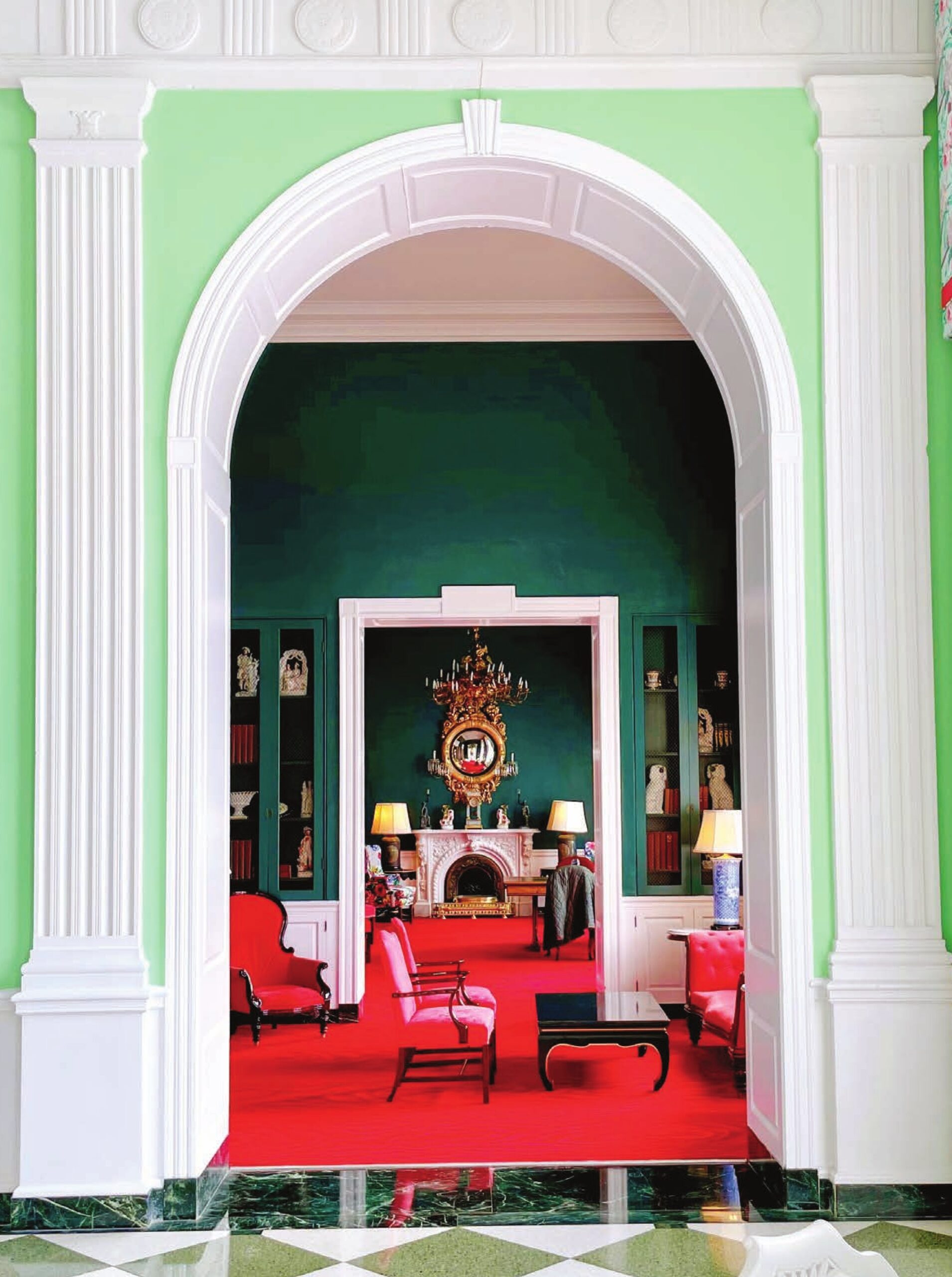 The vivid green-and-red interiors of the Greenbrier resort, with marble checkered floors, antique furnishings, and elaborate millwork.