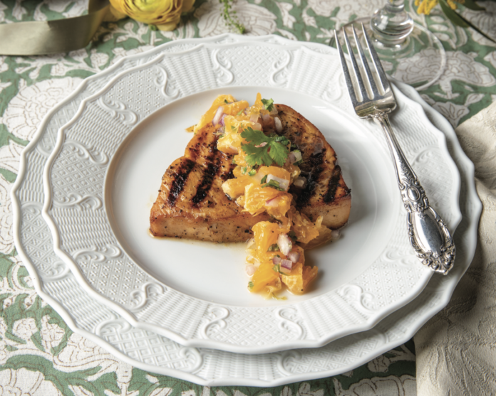 Swordfish Steaks with Tangerine Salsa on a plate.