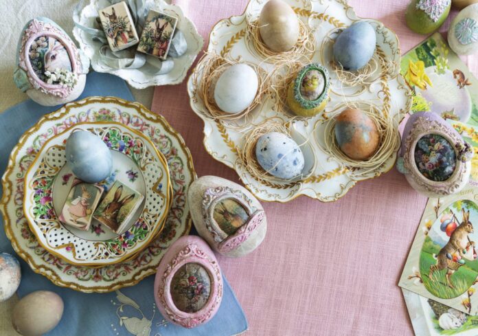 Hand decorated easter eggs in pastel hues derived from natural plant dyes, adorned with vintage easter imagery.
