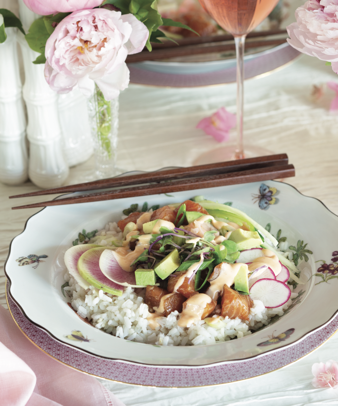 A rice bowl with chopsticks.