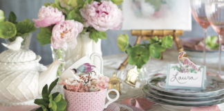 A japanese-inspired tea setting with pink hues and cherry blossom accents.