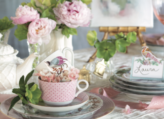 A japanese-inspired tea setting with pink hues and cherry blossom accents.