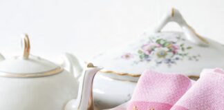 Pink embroidered linen napkins with a tea set.