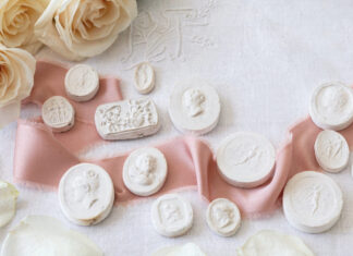 Plaster intaglios with a pink ribbon and roses