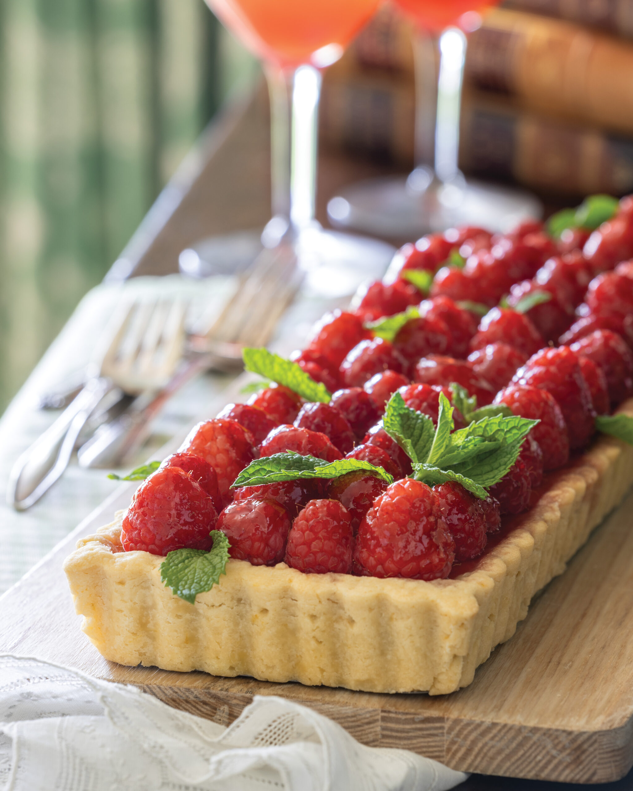 Raspberry tart on a wooden board