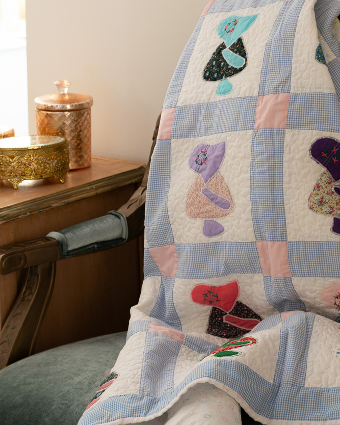 Quilt draped on chair