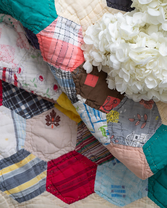 Quilts folded with hydrangeas