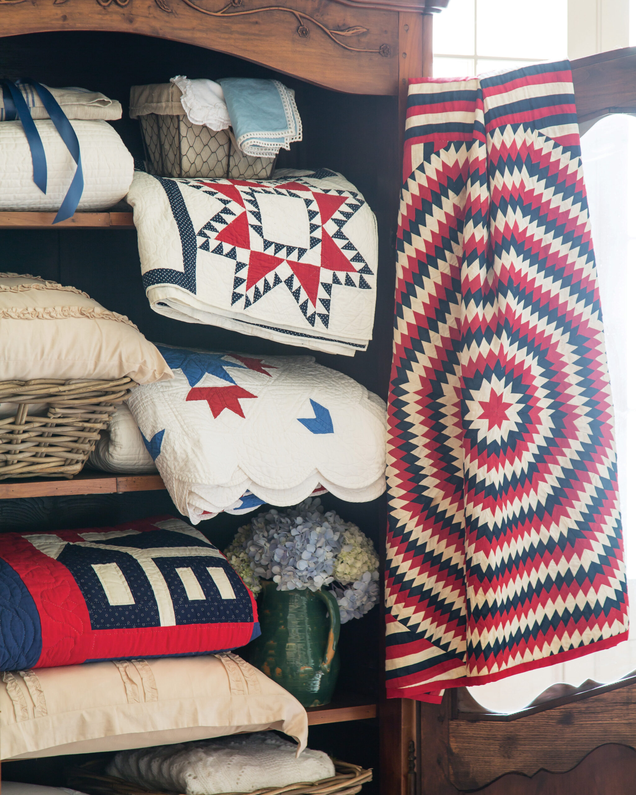 Quilts folded in a cabinet