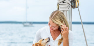 Woman on a boat with a dog