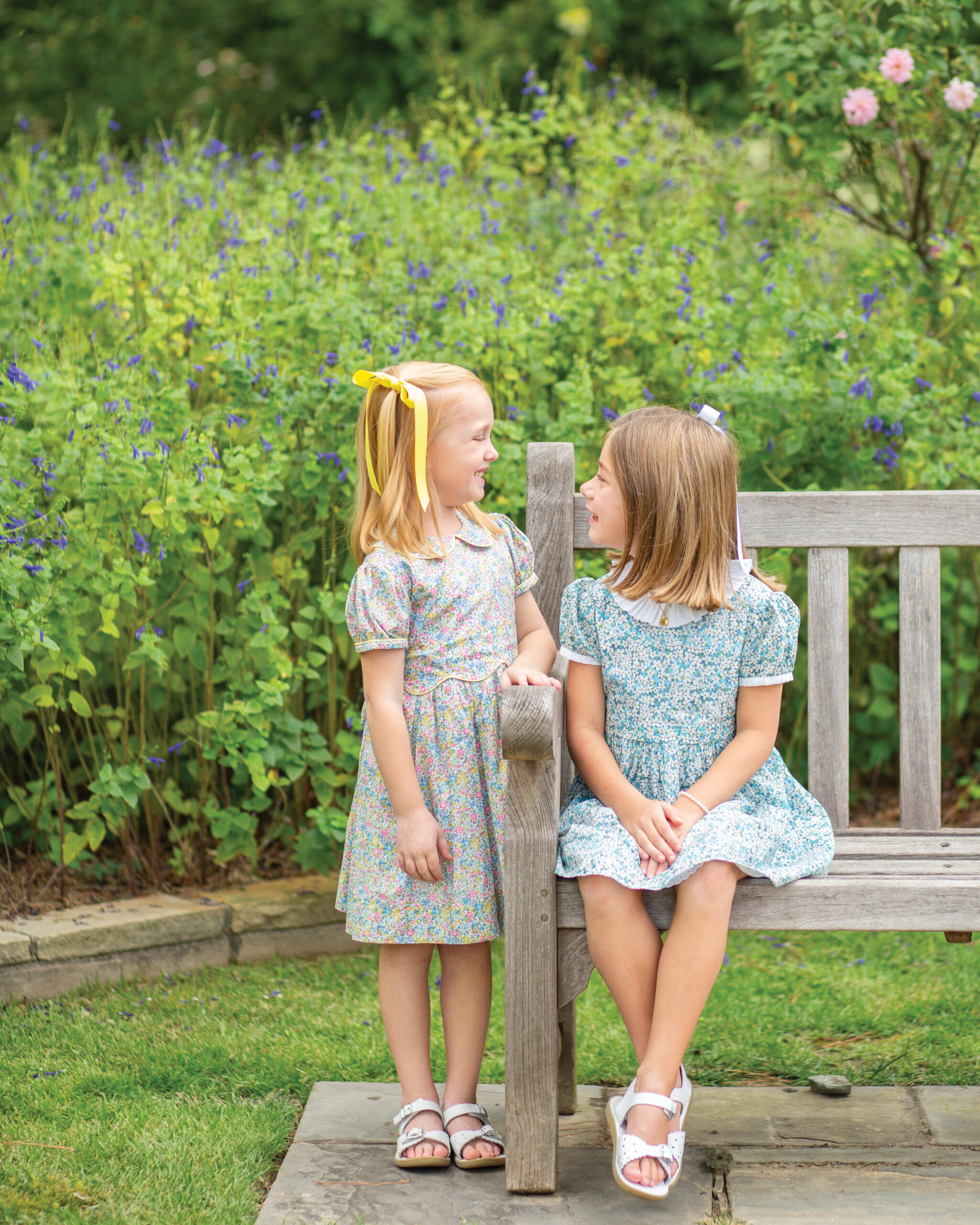 2 little girls in floral dresses