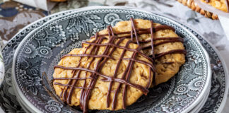 Chocolate hobnob cookies on a blue plate