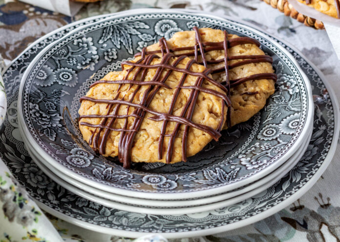 Chocolate hobnob cookies on a blue plate