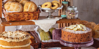 Assortment of breads, cakes, and cookies on a table